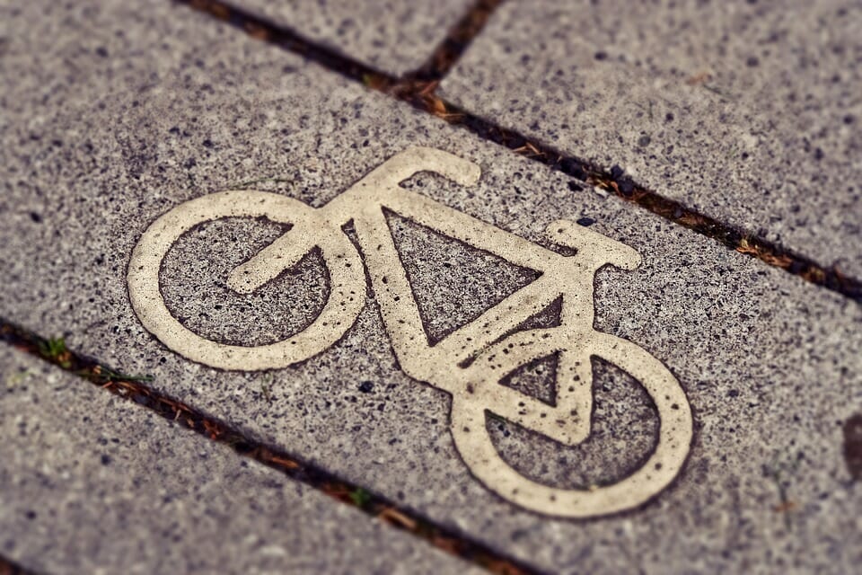 The logo on the sidewalk notes that you are on a bike path.